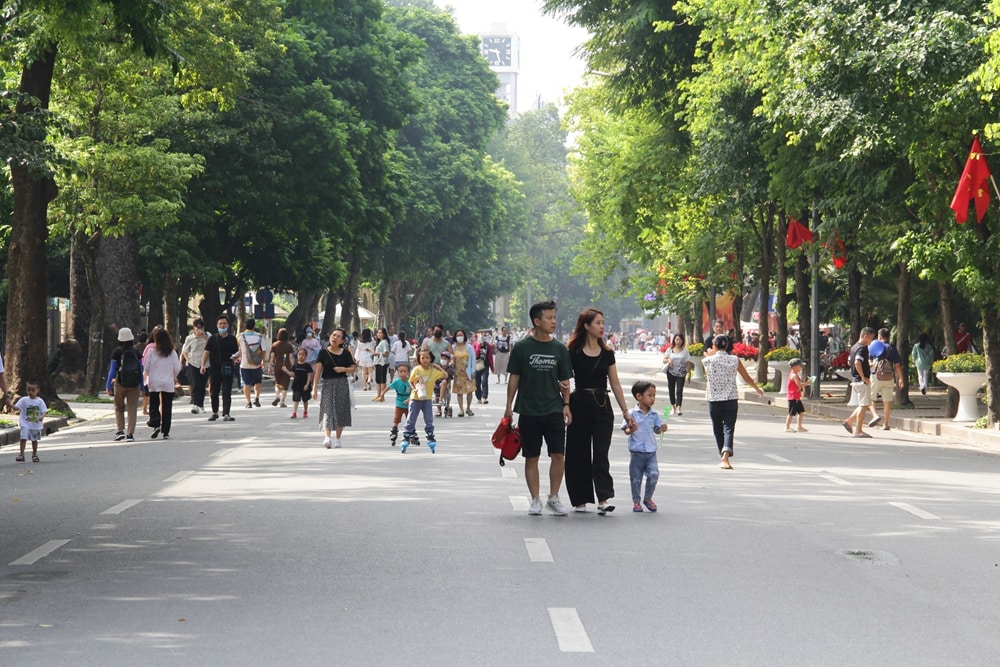 Locals walk along the walking street 
